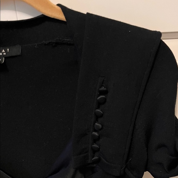 Light weight sweater with satin ribbon over chest, low cut and form fitting. - Picture 4 of 5